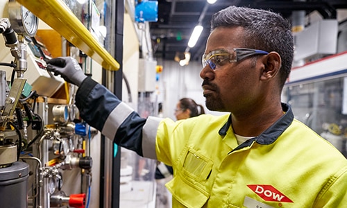 Dow employee monitors equipment