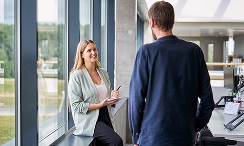 Two colleagues talking in the office